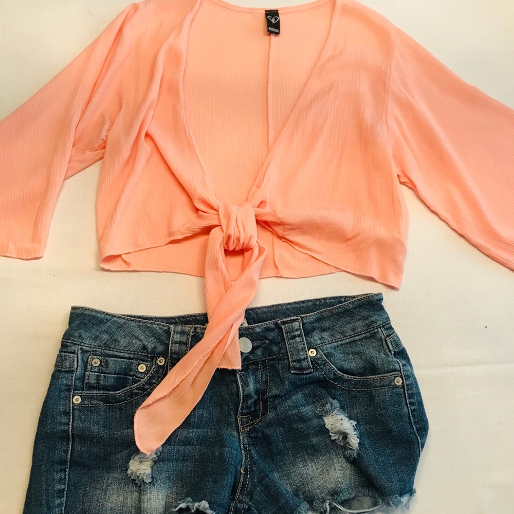 Blouse only. Shorts sold separately.